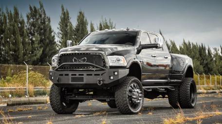Powerful Ram Pickup under Stormy Skies wallpaper