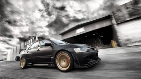 Vintage Mitsubishi in Stormy Skies wallpaper