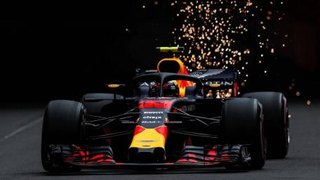 F1 Car Speeds Through Sparks at Night wallpaper