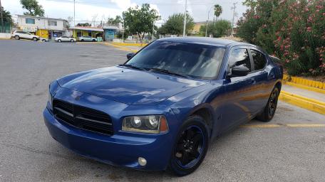 Sleek Blue Charger in a Urban Setting wallpaper
