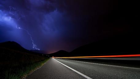 Striking Lightning Over a Dark Highway wallpaper