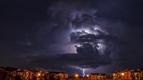 Dramatic Lightning Dance Over Cityscape wallpaper