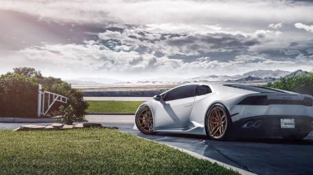 Sleek Lamborghini in a Dreamy Landscape wallpaper