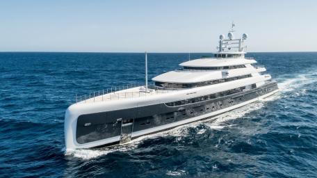 Sleek Superyacht Gliding Through Azure Waters wallpaper