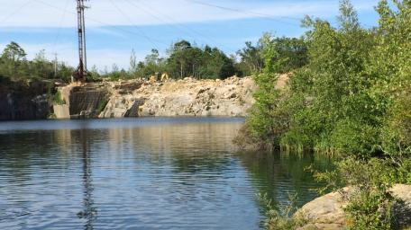 Serene Quarry Reflections Amidst Nature's Beauty wallpaper
