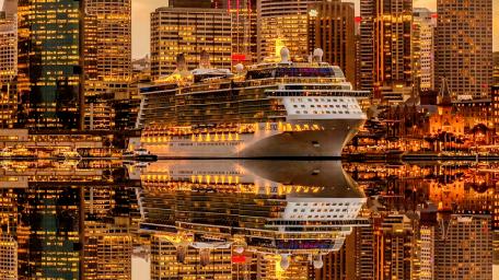 Majestic Cruise Ship in City Lights wallpaper
