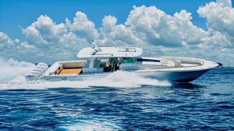Sleek Motorboat Cutting Through Waves in 4K wallpaper