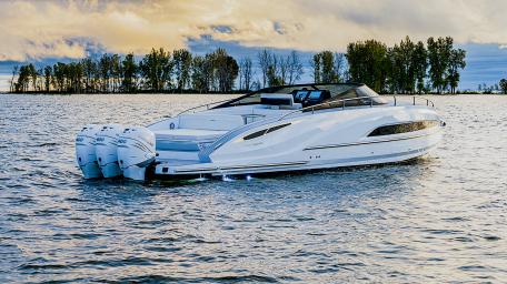 Sleek Motorboat Gliding over Calm Waters wallpaper