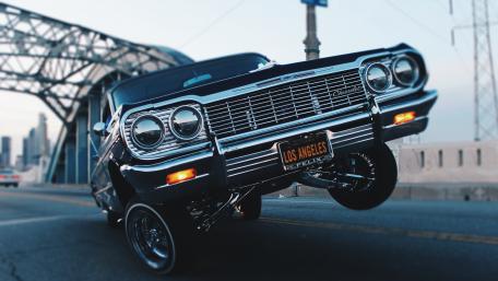 Vintage Chevrolet Impala in Urban Sunset wallpaper