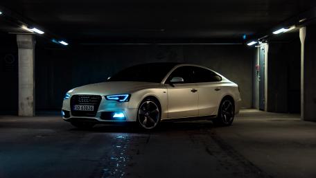 Sleek Audi A5 in Urban Night Setting wallpaper