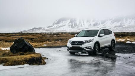 Sleek Honda SUV on Icy Terrain wallpaper