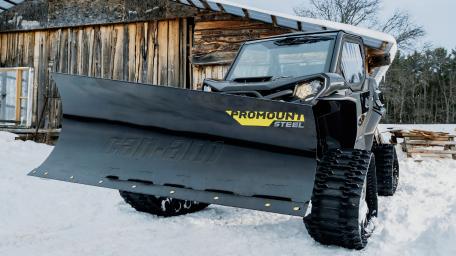 Powerful Utility Vehicle in a Snowy Landscape wallpaper