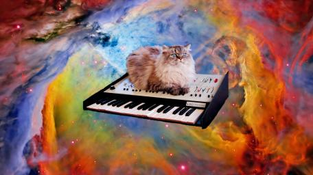 Cosmic Cat Playing the Piano in Nebula Dreams wallpaper