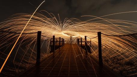 Mystical Night Dock with Light Trails wallpaper