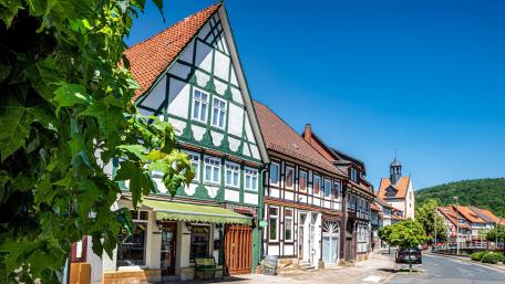 Charming Half-Timbered Village Homes Proudly Displayed Under Clear Blue Skies wallpaper
