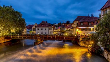 Old houses and Regnitz River in city center Bamberg at the evening wallpaper