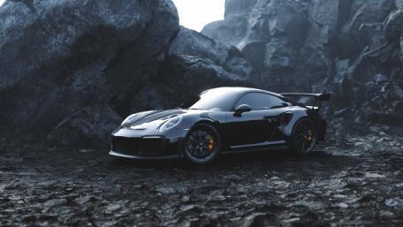 Sleek Black Porsche Among Rugged Rocks wallpaper