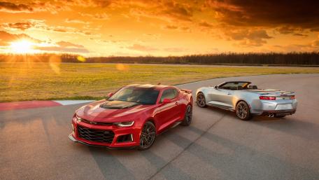 Dynamic Chevrolet Camaro Duo at Sunset Drive wallpaper