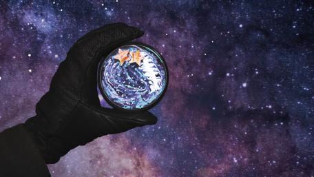 Cosmic Dreamscape in Hand wallpaper