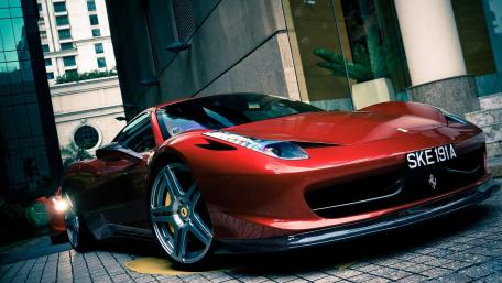 Sleek Ferrari in Urban Setting wallpaper