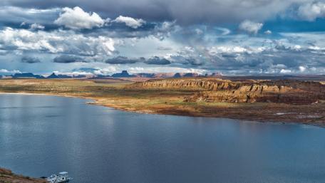 Serene Lake Landscape Under Dramatic Skies wallpaper