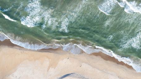 Serene Beach Waves from Above wallpaper