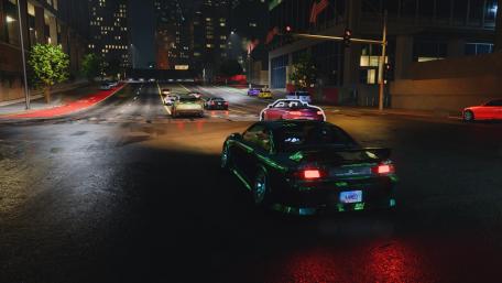 Urban Night Drive with Sleek Cars and Vibrant Lights wallpaper