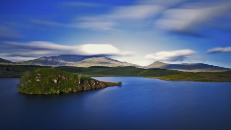 Tranquil Island Landscape Under Blue Skies wallpaper