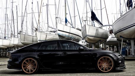 Sleek Audi S7 Among Sailboats wallpaper