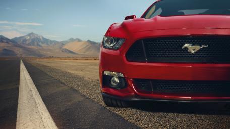 Dynamic Ford Mustang on Open Road wallpaper