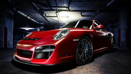 Sleek Red Porsche 911 Targa in Mysterious Garage Setting wallpaper
