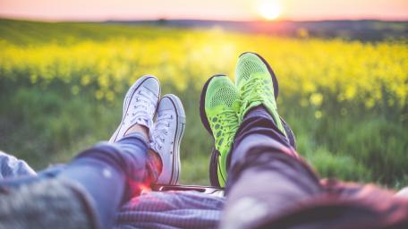 Couple's Sunset Picnic Footwear Scene wallpaper
