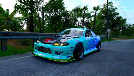Dynamic Drift Car on Tropical Road Scene wallpaper