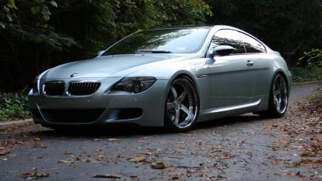 Sleek BMW Coupe on a Scenic Road wallpaper