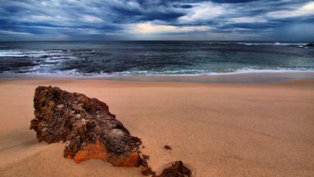 Serene Beach View with Dramatic Skies wallpaper