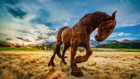 Majestic Horse Sculpture in Nature Landscape wallpaper