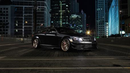 Sleek Mercedes-Benz C63 in Urban Nightscape wallpaper