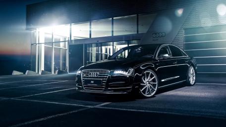 Sleek Audi A8 Under City Lights wallpaper