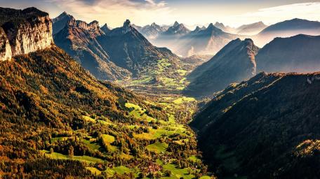 Majestic Valley Surrounded by Majestic Mountains wallpaper