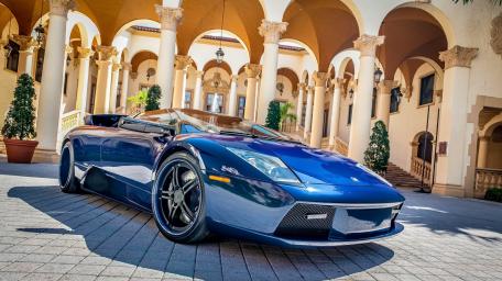 Sleek Lamborghini Murciélago in Elegant Courtyard Scene wallpaper