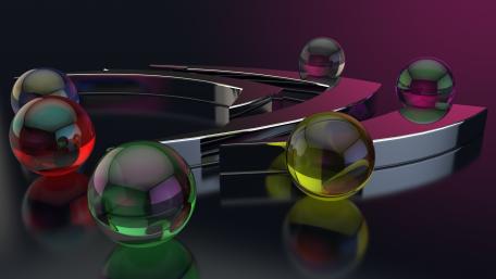 Vibrant Glass Spheres on a Sleek Surface wallpaper