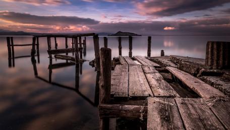 Serene Sunset Over an Abandoned Pier wallpaper