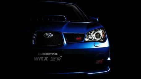 Sleek Subaru Impreza WRX STI on Dark Background wallpaper
