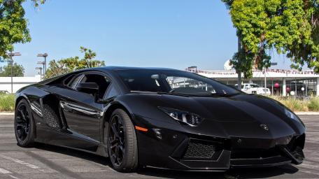 Sleek Black Lamborghini Aventador Wallpaper wallpaper