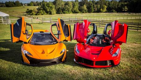 Supercars Showdown in a Scenic Landscape wallpaper