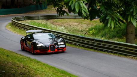 Sleek Bugatti Veyron on a Curvy Track wallpaper
