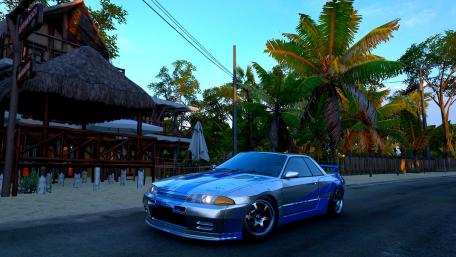 Sleek Silver Sports Car in Tropical Paradise wallpaper