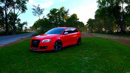 Vibrant Red Audi in Nature Scene wallpaper