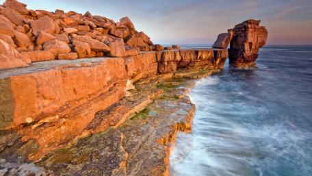 Majestic Cliffs Overlooking the Ocean Waves wallpaper