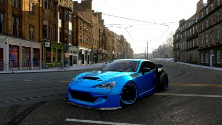 Stunning Blue Sports Car in Urban Landscape wallpaper